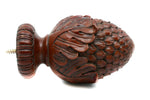 Decorative wooden finial with intricate carvings